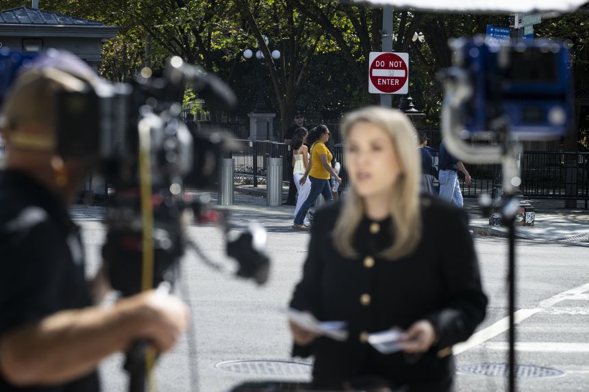 The White House grounds are seen behind CNN senior White House reporter Betsy Klein after the network was denied entry on September 19, 2026.