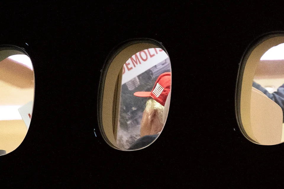 US President Donald Trump is seen aboard Air Force One checking a large Kennedy Center printout after landing at Joint Base Andrews, Maryland on September 16, 2026.