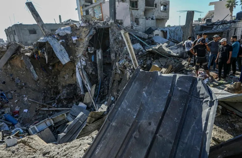 Palestinians inspect the site of an Israeli airstrike in Khan Yunis, southern Gaza Strip, September 9, 2026. (credit: ABED RAHIM KHATIB/FLASH90)