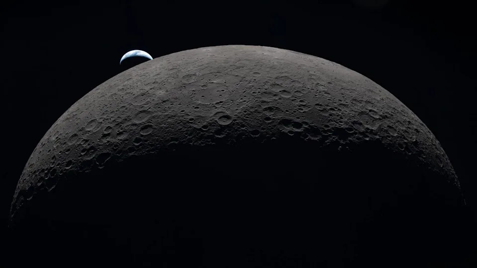 A view of the moon in the foreground with a small Earth in the background.