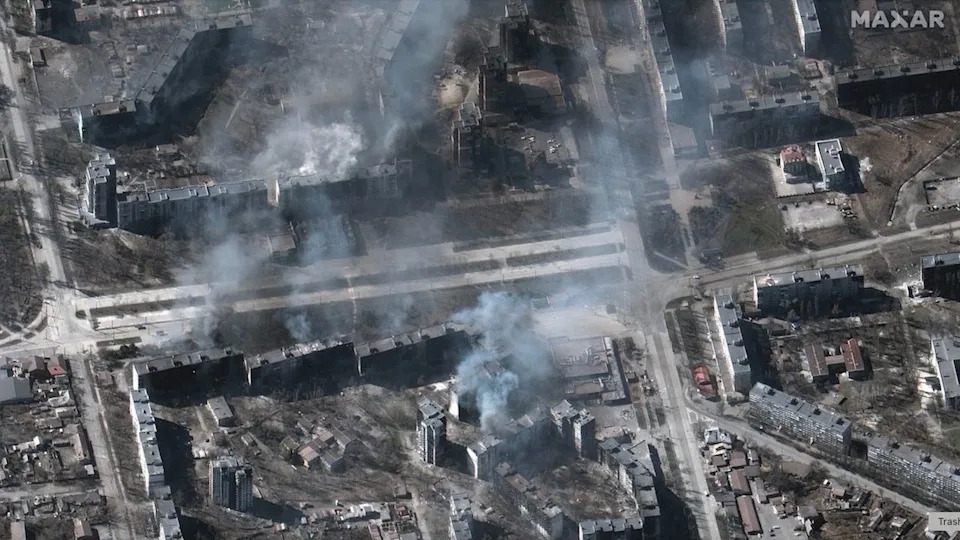 Maxar Technologies' Worldview-3 satellite captured this image of buildings on fire in the Ukrainian city of Mariupol on March 22, 2022, four weeks after Russia began its ongoing invasion of Ukraine.