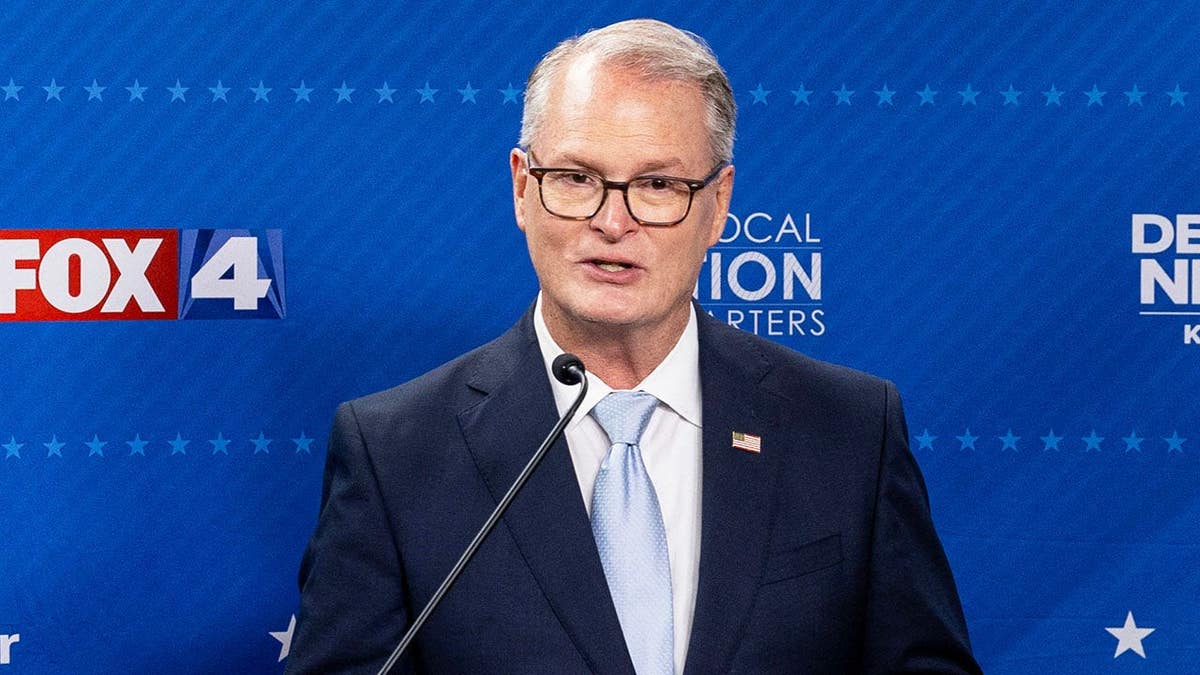 Adam Hamilton answers questions from media after a televised debate with Roger Marshall in Kansas City.