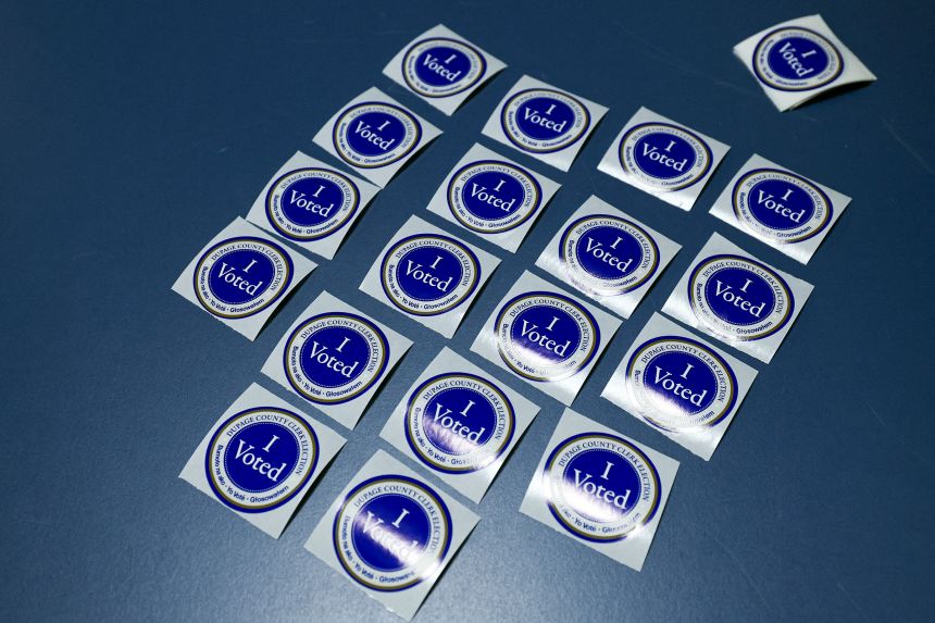 "I Voted" stickers sit on a table at Naperville Municipal Center in Naperville, Illinois, on September 24, 2026, on the first day of early voting ahead of the November 3 midterm elections.